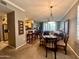 Bright dining area with a table and chairs, open to the living room at 20100 N 78Th Pl # 3090, Scottsdale, AZ 85255