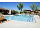 Inviting community pool with lounge chairs and shade structures at 20100 N 78Th Pl # 3090, Scottsdale, AZ 85255