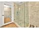 Walk-in shower with glass enclosure and marble tile at 7137 E Rancho Vista Dr # 7008, Scottsdale, AZ 85251