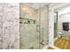 Large walk-in shower with glass enclosure and marble tile at 7137 E Rancho Vista Dr # 7008, Scottsdale, AZ 85251