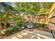 Relaxing patio oasis with a hanging chair and greenery at 7137 E Rancho Vista Dr # 7008, Scottsdale, AZ 85251