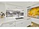 Modern kitchen with white cabinets, quartz countertops, and stainless steel sink at 7137 E Rancho Vista Dr # 7008, Scottsdale, AZ 85251