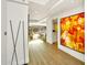 Bright and spacious entryway with hardwood floors and large artwork at 7137 E Rancho Vista Dr # 7008, Scottsdale, AZ 85251