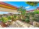 Private patio with lush landscaping and seating area at 7137 E Rancho Vista Dr # 7008, Scottsdale, AZ 85251