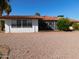 White single-story home with red tile roof at 9867 W Roundup Ct, Sun City, AZ 85373