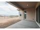 Covered patio with concrete flooring, offering an outdoor space at 10010 S 37Th Ave, Laveen, AZ 85339