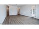 Bedroom with wood-look tile floors and access to back patio at 10010 S 37Th Ave, Laveen, AZ 85339