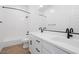 Modern bathroom with white vanity, black fixtures, and a bathtub at 10010 S 37Th Ave, Laveen, AZ 85339