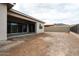 Covered patio with sliding glass doors leading to the backyard at 10010 S 37Th Ave, Laveen, AZ 85339