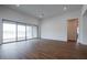 Bright Gathering room with sliding glass doors and wood-look tile floors at 10010 S 37Th Ave, Laveen, AZ 85339