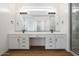 Elegant bathroom with double vanity and large mirror at 10010 S 37Th Ave, Laveen, AZ 85339
