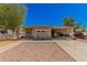 Tan single wide mobile home with covered carport at 8125 E Billings St, Mesa, AZ 85207