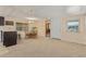 Carpeted dining area with table and chairs near the kitchen at 8125 E Billings St, Mesa, AZ 85207