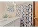 Clean bathroom with white vanity and shower/tub combo at 8125 E Billings St, Mesa, AZ 85207