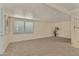 Spacious carpeted living room with large window at 8125 E Billings St, Mesa, AZ 85207