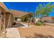 Home's backyard with covered patio and storage shed at 8125 E Billings St, Mesa, AZ 85207