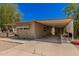 Tan single wide mobile home with covered carport at 8125 E Billings St, Mesa, AZ 85207