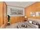 Bedroom with wood paneling, a double bed, and built-in drawers at 8125 E Billings St, Mesa, AZ 85207