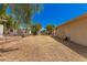 Side yard with gravel ground cover and some vegetation at 8125 E Billings St, Mesa, AZ 85207