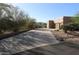 Long driveway leading to a two-car garage and expansive home with desert landscaping at 19132 W Townley Ct, Waddell, AZ 85355