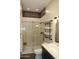 Bathroom with walk-in shower, quartz vanity, and modern lighting at 19132 W Townley Ct, Waddell, AZ 85355