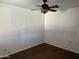 Bright bedroom with ceiling fan and brown carpet at 7501 N 59Th Dr, Glendale, AZ 85301