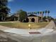 Brick home with a large front yard, mature trees, and a curved driveway at 7501 N 59Th Dr, Glendale, AZ 85301