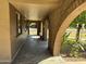 Covered walkway with brick arches and a view of the street at 7501 N 59Th Dr, Glendale, AZ 85301