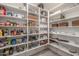 Large walk-in pantry with ample shelving for storage at 20955 E Mayberry Rd, Queen Creek, AZ 85142