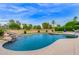 Inviting kidney-shaped pool with waterfall feature at 17603 N Lindgren Ave, Sun City, AZ 85373