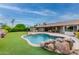 Relaxing kidney-shaped pool with rock waterfall feature at 17603 N Lindgren Ave, Sun City, AZ 85373