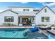 Inviting pool and patio area with lounge chairs and a view of the home's exterior and landscaping at 4007 E Montecito Ave, Phoenix, AZ 85018