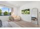 Main bedroom with a plush bed, circular chair, and large window at 4007 E Montecito Ave, Phoenix, AZ 85018