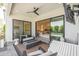 Outdoor patio features a fire pit, comfortable seating, and views into the home's interior, including the kitchen and living areas at 4007 E Montecito Ave, Phoenix, AZ 85018