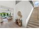 Bright and airy entryway with light wood floors and staircase at 4007 E Montecito Ave, Phoenix, AZ 85018