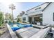 Modern pool and patio with comfortable lounge chairs, offering a view of the home's exterior at 4007 E Montecito Ave, Phoenix, AZ 85018