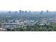 Aerial view of a neighborhood featuring shopping areas and a cityscape at 4007 E Montecito Ave, Phoenix, AZ 85018