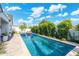 Stunning rectangular pool with lounge chairs and lush landscaping at 4007 E Montecito Ave, Phoenix, AZ 85018