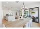Open concept dining area with large table, and view into the kitchen and living room at 4007 E Montecito Ave, Phoenix, AZ 85018