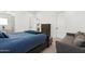 Bright bedroom with a wooden bed frame and a small couch at 4007 E Montecito Ave, Phoenix, AZ 85018