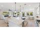 Open floor plan with kitchen island, living area, and fireplace at 4007 E Montecito Ave, Phoenix, AZ 85018