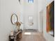 Modern entryway with light wood floors, a console table and large art at 4007 E Montecito Ave, Phoenix, AZ 85018