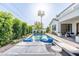 Spacious pool and patio with comfortable lounge chairs and a view of the home's exterior at 4007 E Montecito Ave, Phoenix, AZ 85018