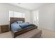 Comfortable bedroom with a wooden bed frame and en-suite bathroom at 4007 E Montecito Ave, Phoenix, AZ 85018