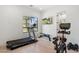 Home gym with treadmill, stationary bike, and weight bench at 4007 E Montecito Ave, Phoenix, AZ 85018