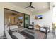 Relaxing outdoor patio with fire pit and comfortable seating, offering views of the interior living space at 4007 E Montecito Ave, Phoenix, AZ 85018