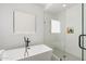 Clean bathroom with soaking tub and walk-in shower at 4007 E Montecito Ave, Phoenix, AZ 85018