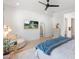 Main bedroom with a plush bed, circular chair, and large window at 4007 E Montecito Ave, Phoenix, AZ 85018
