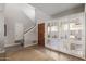 Bright entryway with stairs, wood floors, and white shutters at 4525 N 66Th St # 70, Scottsdale, AZ 85251
