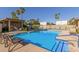 Community pool with lounge chairs and a spa at 4525 N 66Th St # 70, Scottsdale, AZ 85251